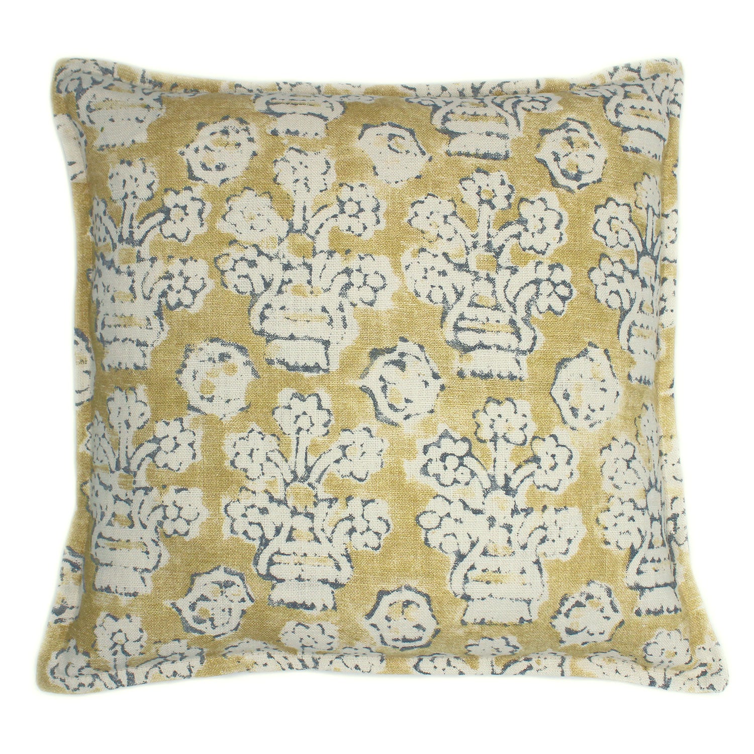 A yellow, blue and cream linen cushion with a block print pattern.