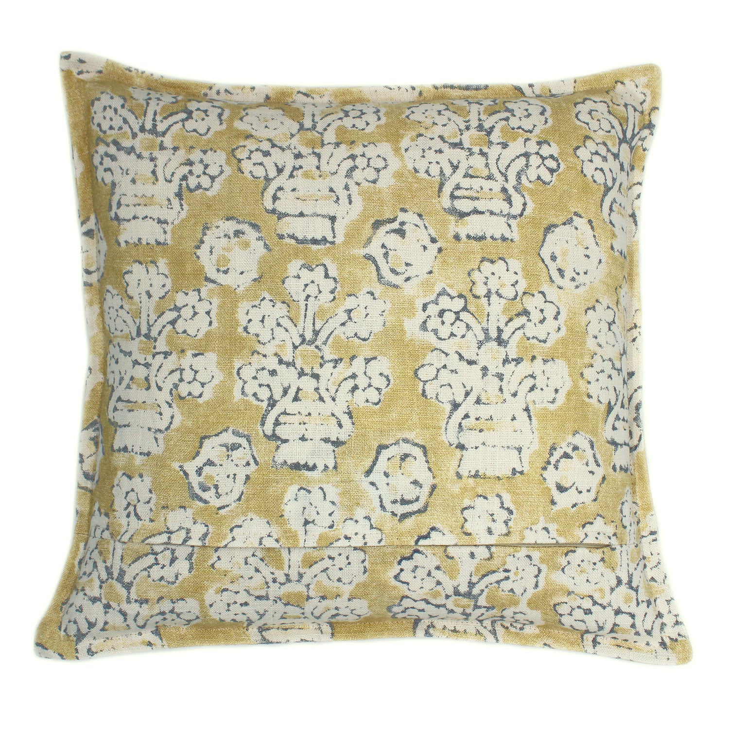 A yellow, blue and cream linen cushion with a block print pattern.