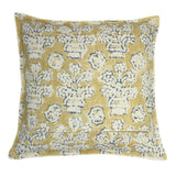 A yellow, blue and cream linen cushion with a block print pattern.