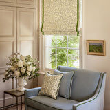 Blinds made from a printed linen fabric in blue, green, and off white featuring a feel of a classic animal print.