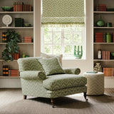 Armchair upholstered in a printed linen fabric in green and off white featuring a Japanese print.