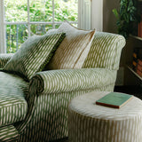 Armchair upholstered in a printed linen fabric in green and off white featuring a Japanese print.