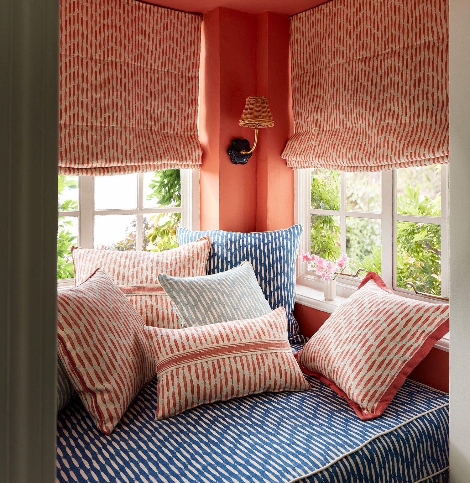 Window seat upholstered in a printed linen fabric in blue and off white featuring a Japanese print.