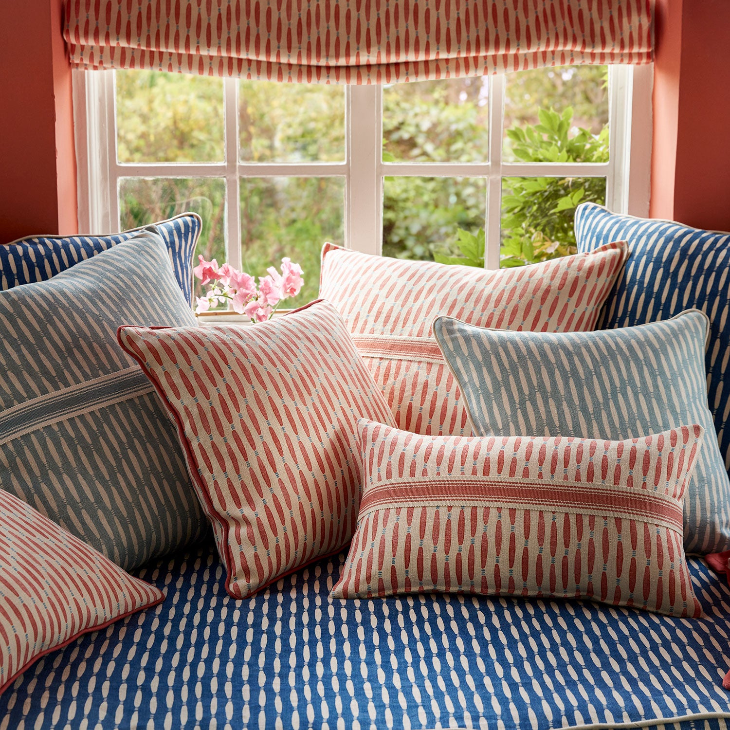 Window seat upholstered in a printed linen fabric in blue and off white featuring a Japanese print.