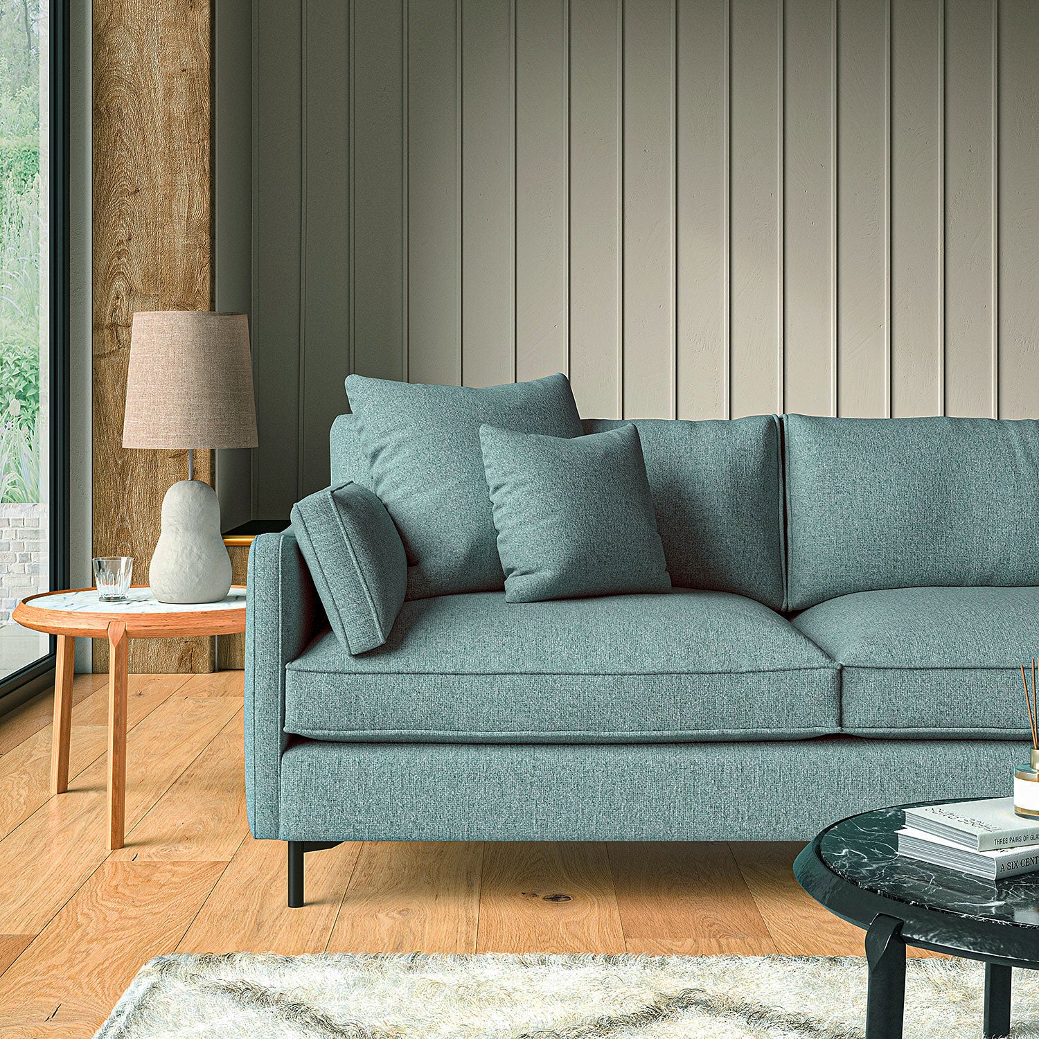 Sofa covered in a boucle fabric in Fjord