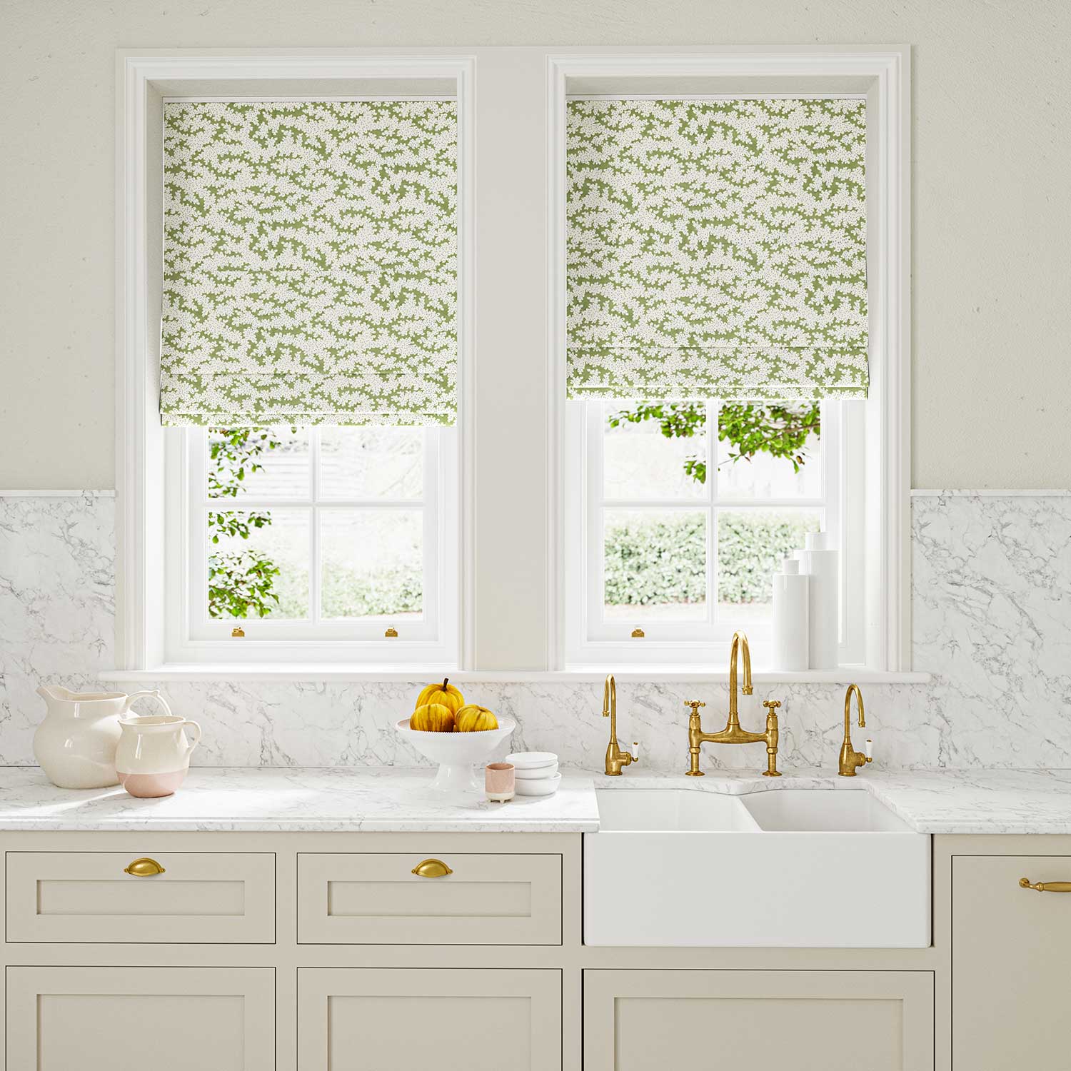 Blinds made from a printed linen fabric sample in green, blue and off white featuring a stylized coral pattern.