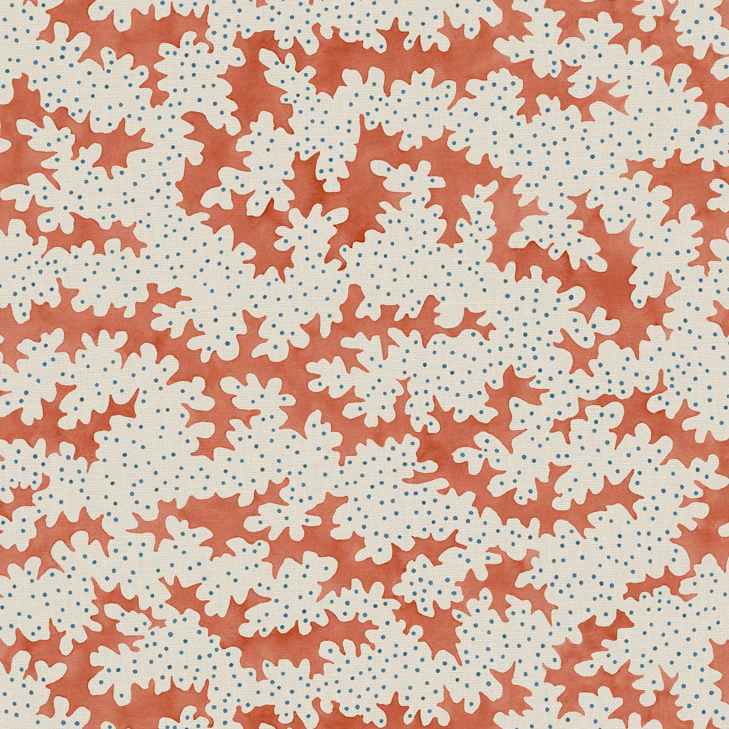 A printed linen fabric sample in orange, blue and off white featuring a stylized coral pattern.