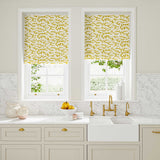 Blinds made from a printed linen fabric sample in yellow, blue and off white featuring a stylized coral pattern.