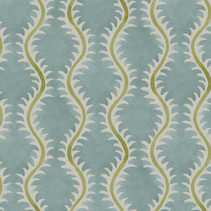 A printed linen fabric sample in blue, green and off white featuring a stylized fern pattern.