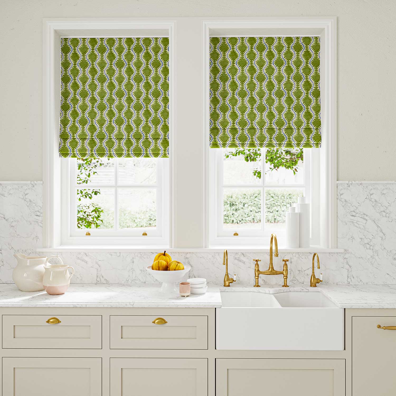 Blinds made from a printed linen fabric sample in blue and green featuring a stylized fern pattern.