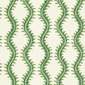 A printed linen fabric sample in green and off white featuring a stylized fern pattern.