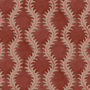 A printed linen fabric sample in red and pink featuring a stylized fern pattern.