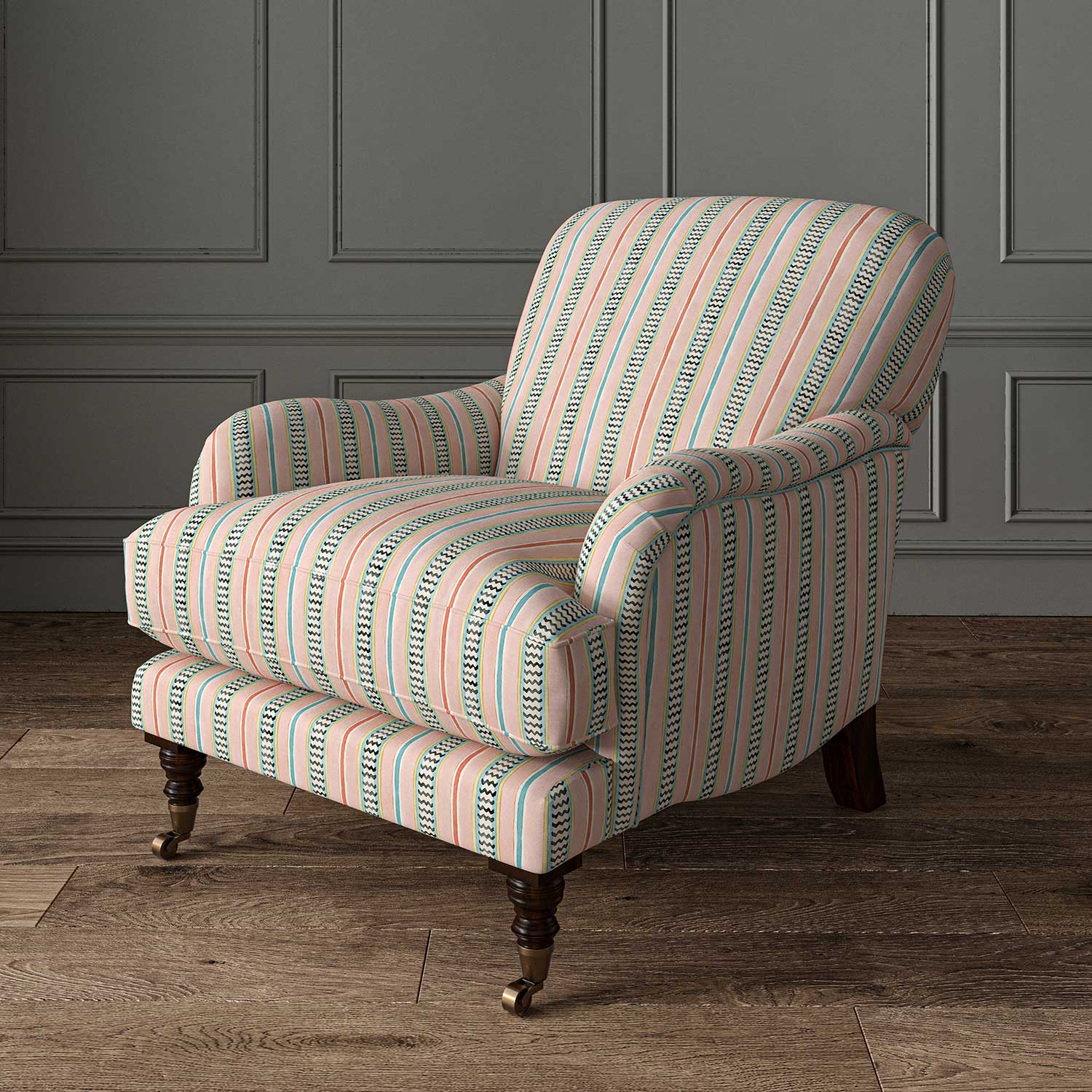 Armchair in a multicoloured – pink, red and blue – printed linen fabric featuring stripes, wavy edges and zigzags.