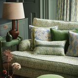 Sofa upholstered in a printed linen fabric in green, blue and off white featuring a basketweave pattern.