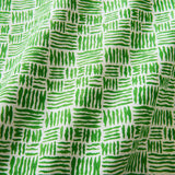 A printed linen fabric sample in green and off white featuring a basketweave pattern.