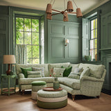 Sofa upholstered in a printed linen fabric in green, blue and off white featuring a basketweave pattern.