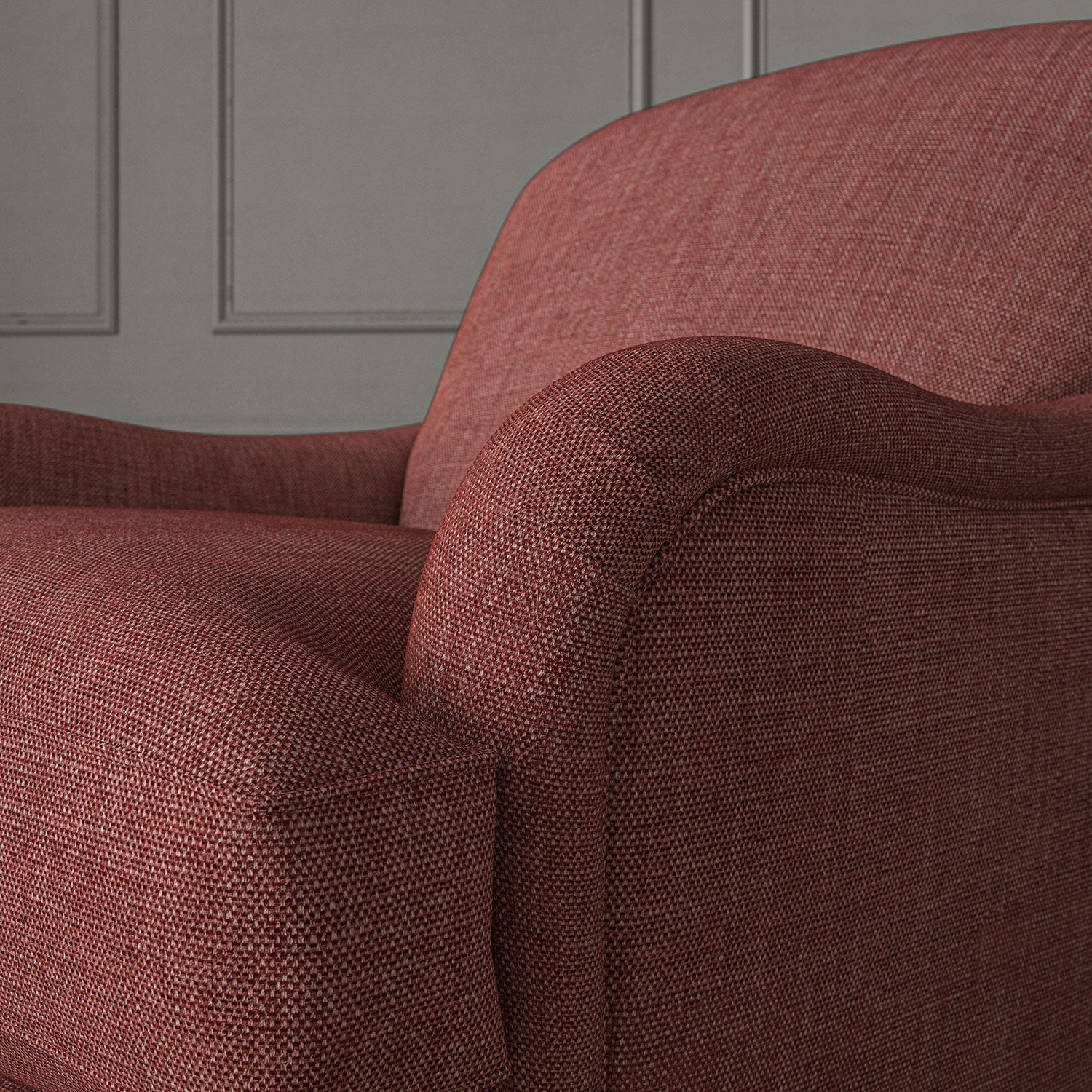 Red chair upholstered in a chenille woven fabric.