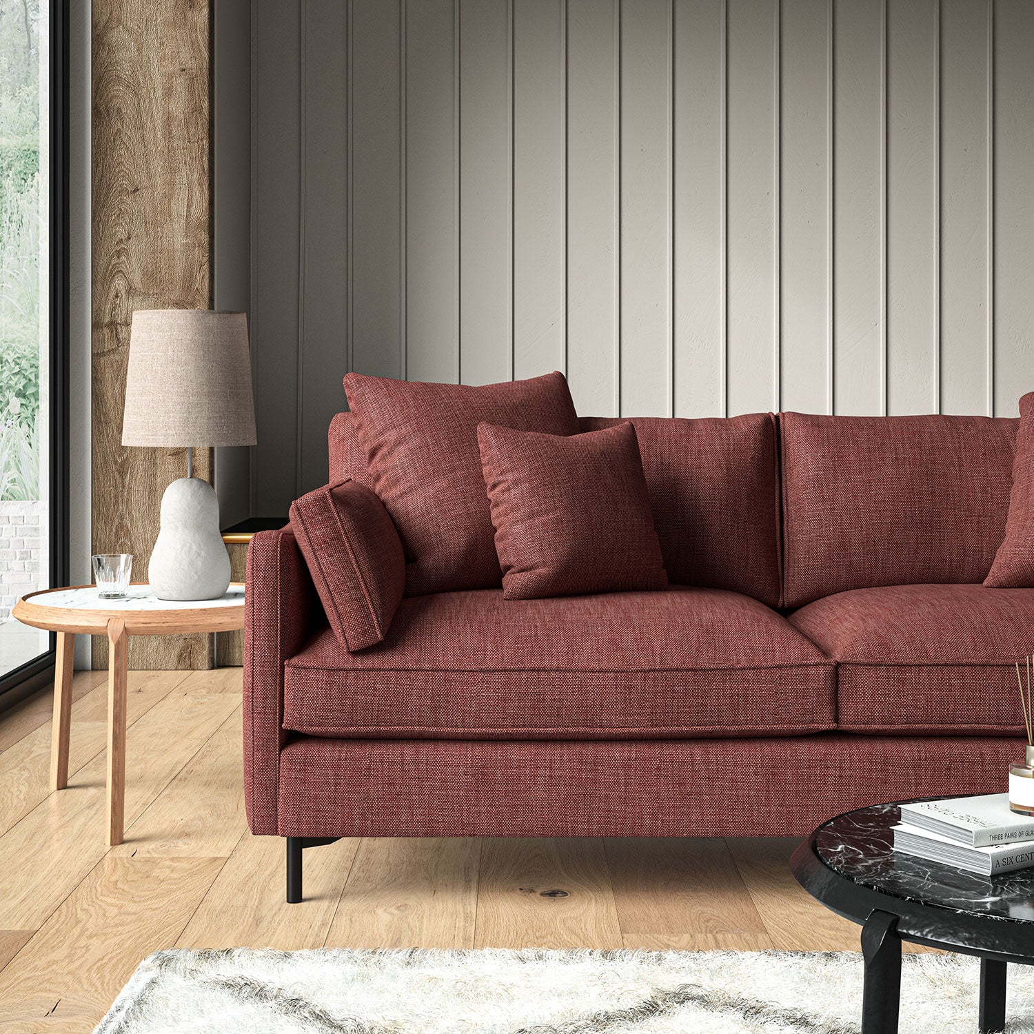 Red sofa upholstered in a chenille woven fabric.