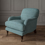 Blue chair upholstered in a chenille woven fabric.