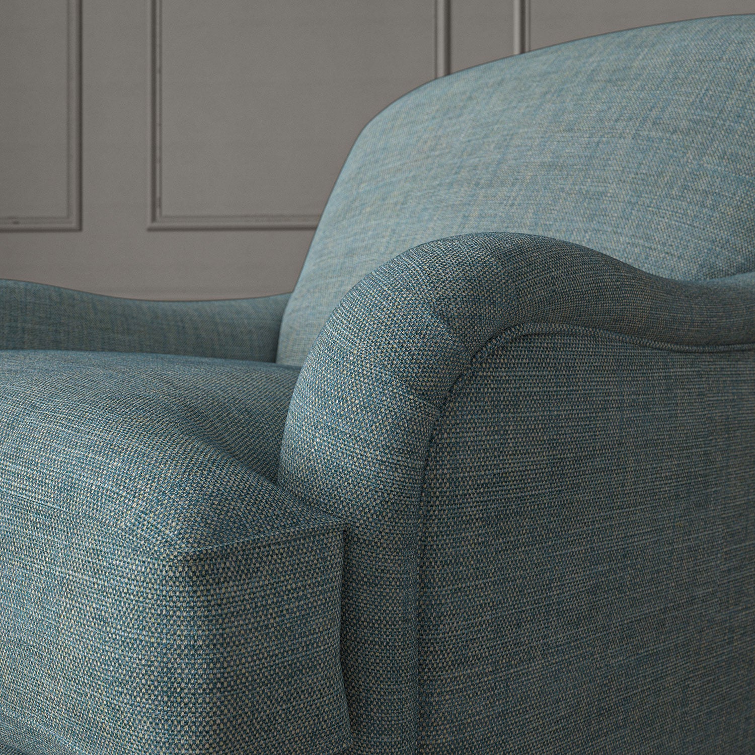 Blue chair upholstered in a chenille woven fabric.