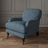 Blue chair upholstered in a chenille woven fabric.