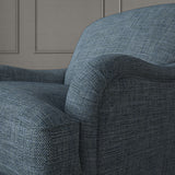 Blue chair upholstered in a chenille woven fabric.