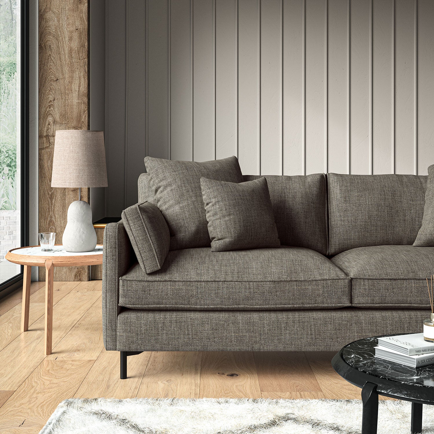 Grey sofa upholstered in a chenille woven fabric.