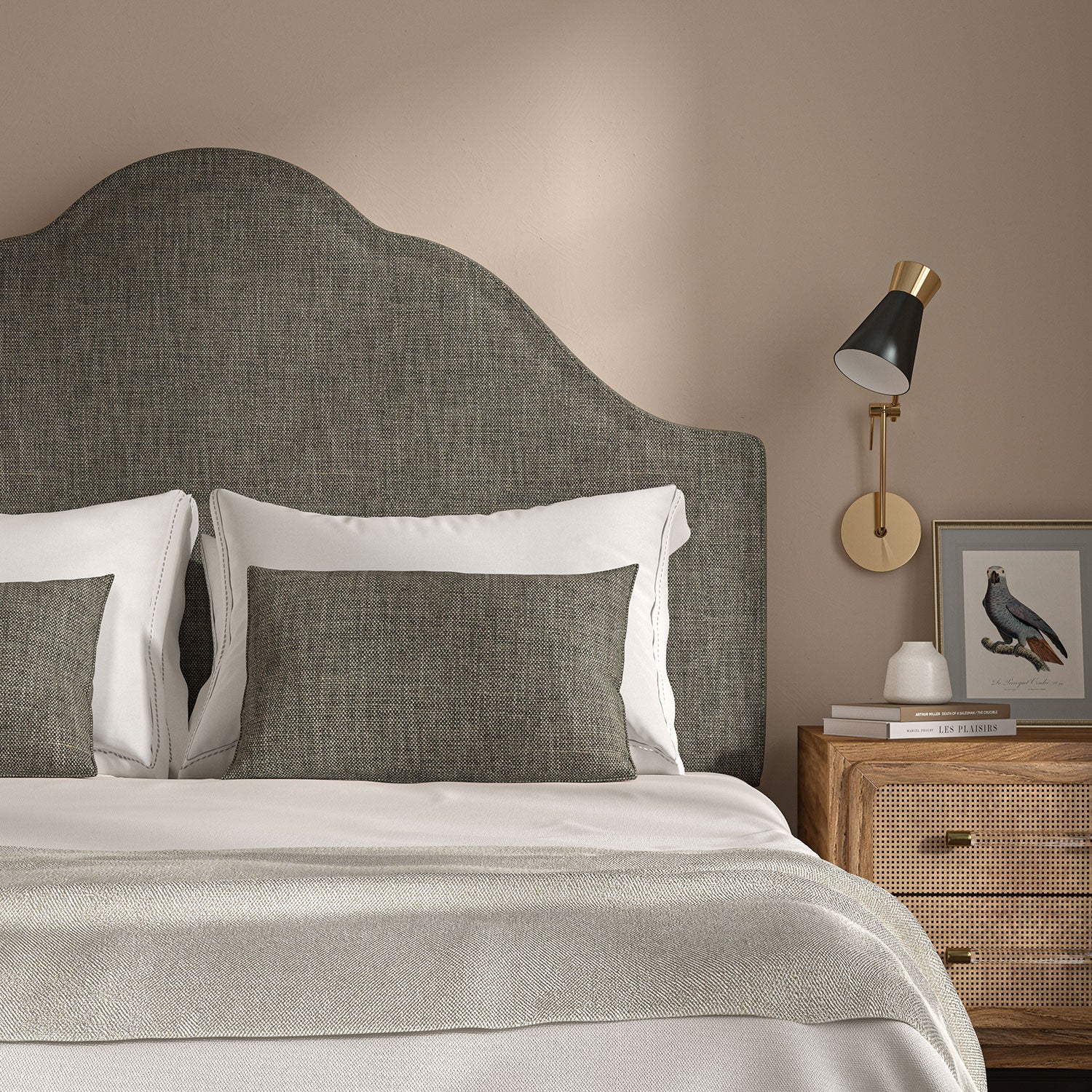 Grey headboard upholstered in a chenille woven fabric.