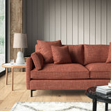 Red sofa upholstered in a chenille woven fabric.