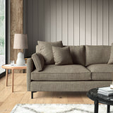 Brown sofa upholstered in a chenille woven fabric.