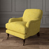 Yellow chair upholstered in a chenille woven fabric.