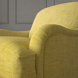 Yellow chair upholstered in a chenille woven fabric.