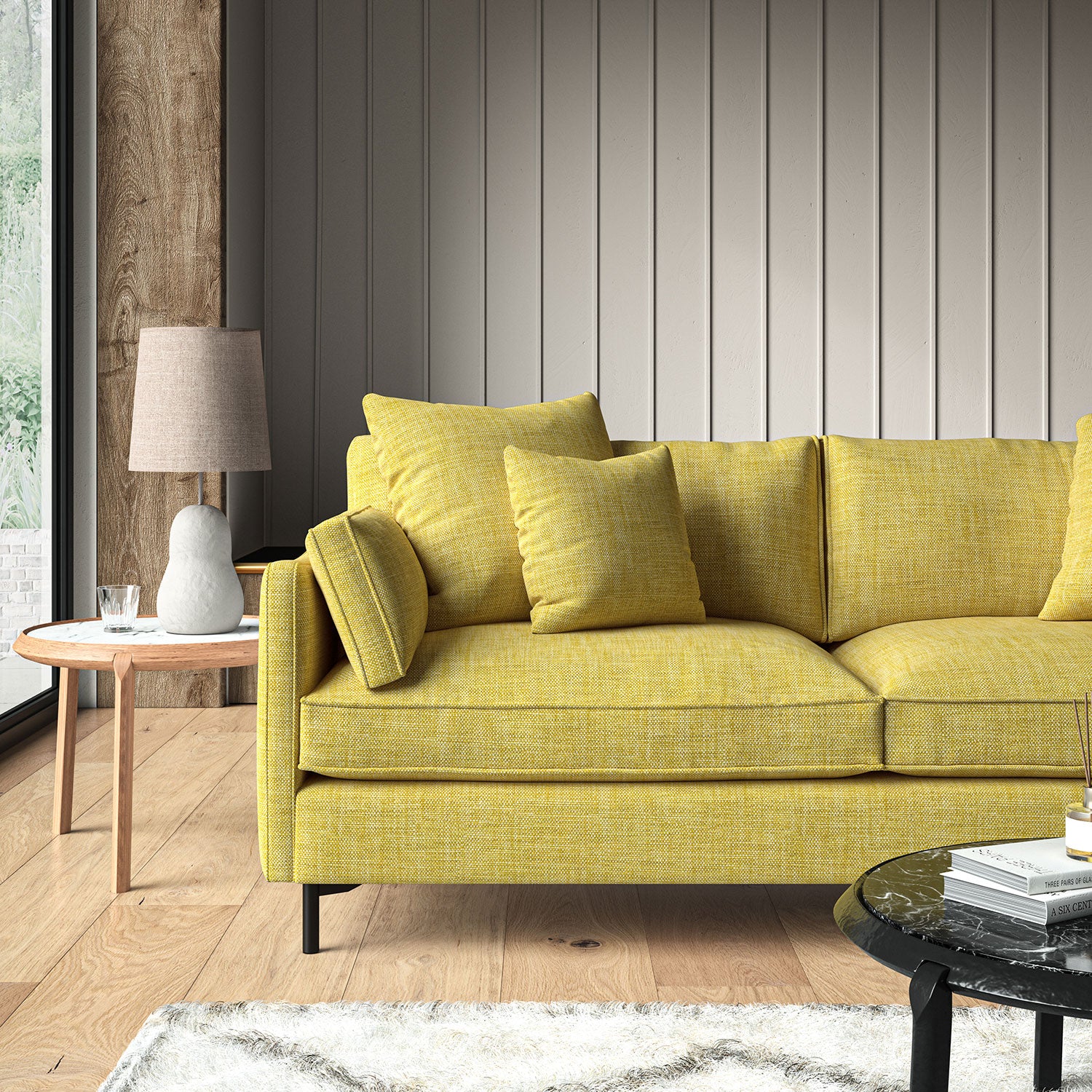 Yellow sofa upholstered in a chenille woven fabric.