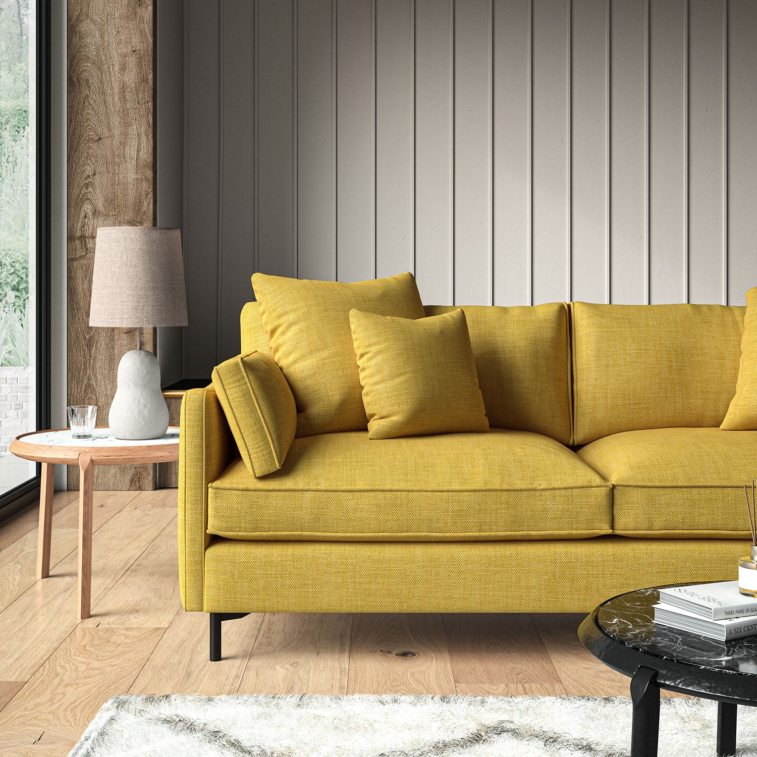 Yellow sofa upholstered in a chenille woven fabric.