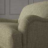 Brown chair upholstered in a chenille woven fabric.