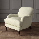 Cream chair upholstered in a chenille woven fabric.