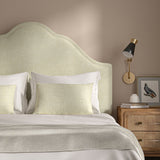 Cream headboard upholstered in a chenille woven fabric.