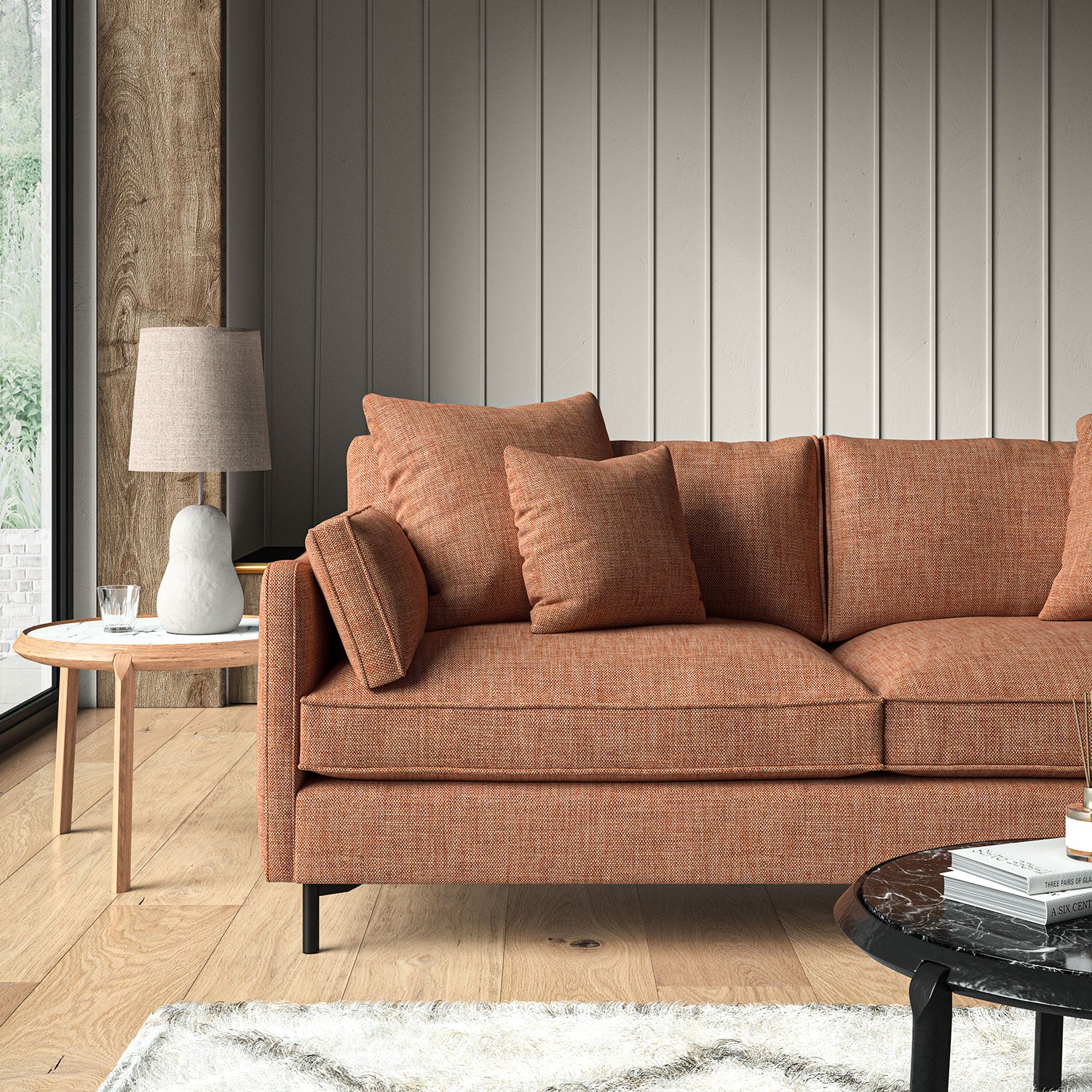 Orange sofa upholstered in a chenille woven fabric.