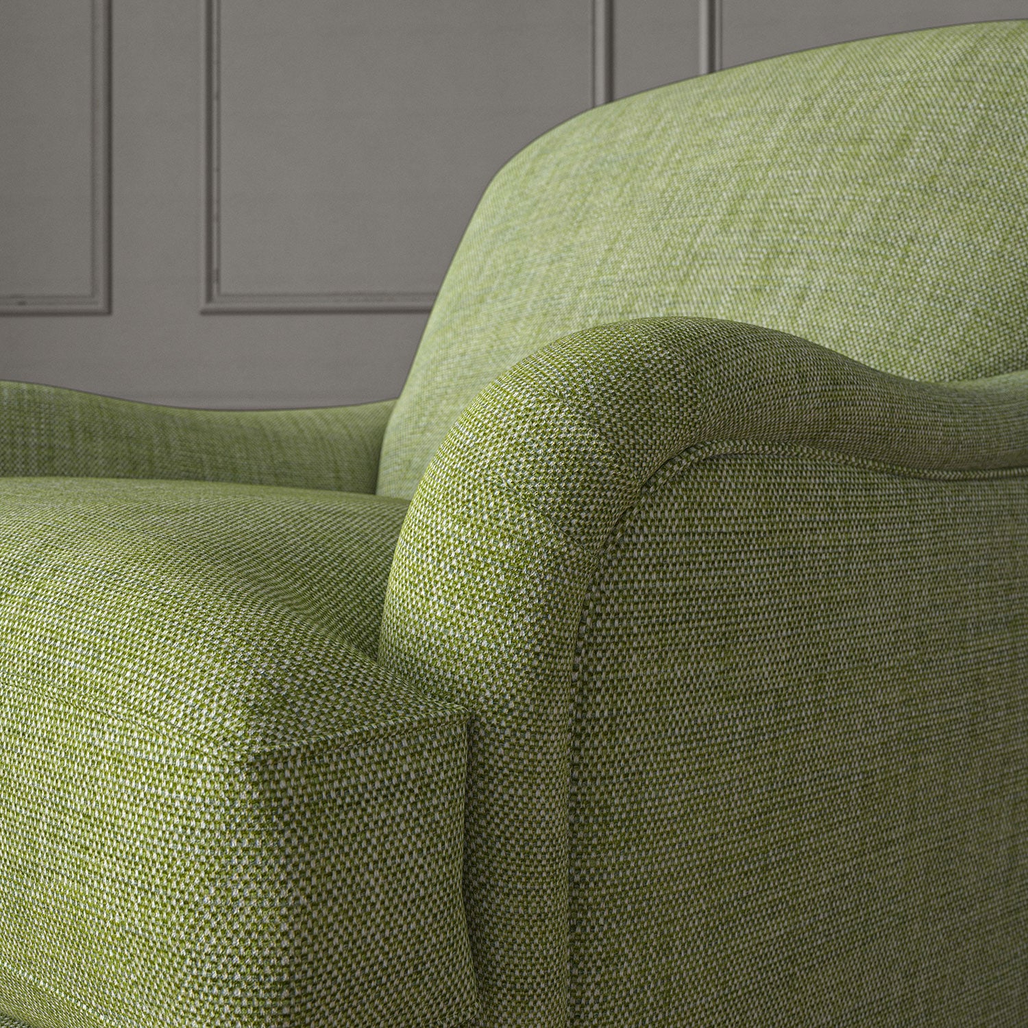 Green chair upholstered in a chenille woven fabric.