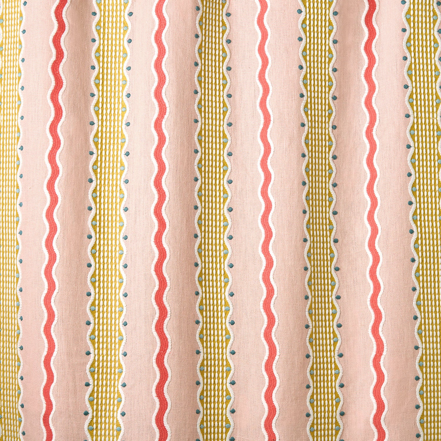 Embroidery fabric with wavy lines and small dots on a pink background.