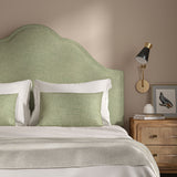 Woven green coloured fabric on a headboard