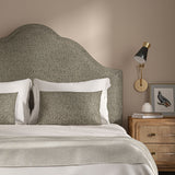 Woven grey coloured fabric on a headboard