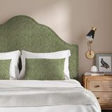 Headboard upholstered in a green and off-white woven fabric featuring a herringbone pattern.