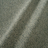 A woven fabric sample in grey and off-white featuring a herringbone pattern.