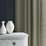 Curtain in grey and off-white woven fabric featuring a herringbone pattern.