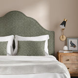 Headboard upholstered in a grey and off-white woven fabric featuring a herringbone pattern.
