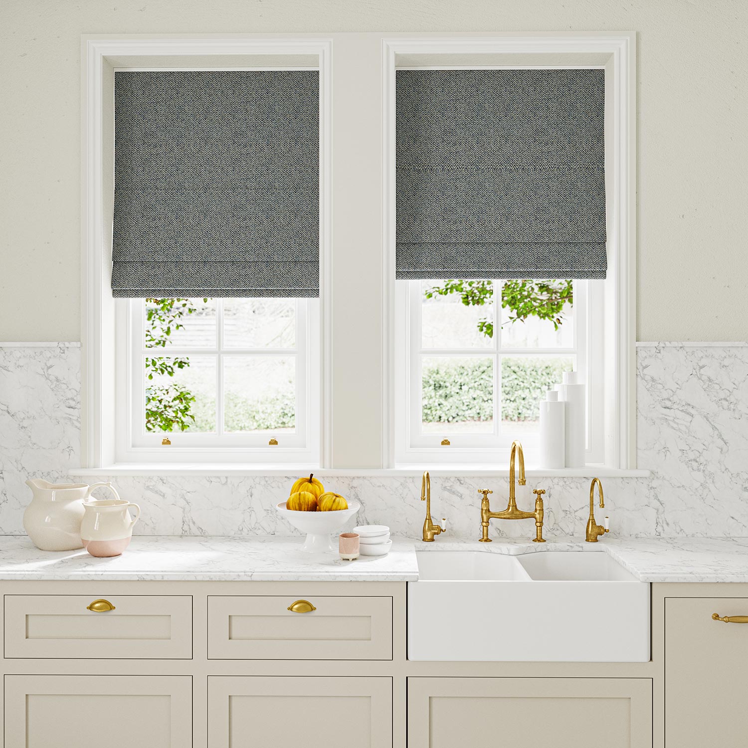 Blinds in blue and off-white woven fabric featuring a herringbone pattern.