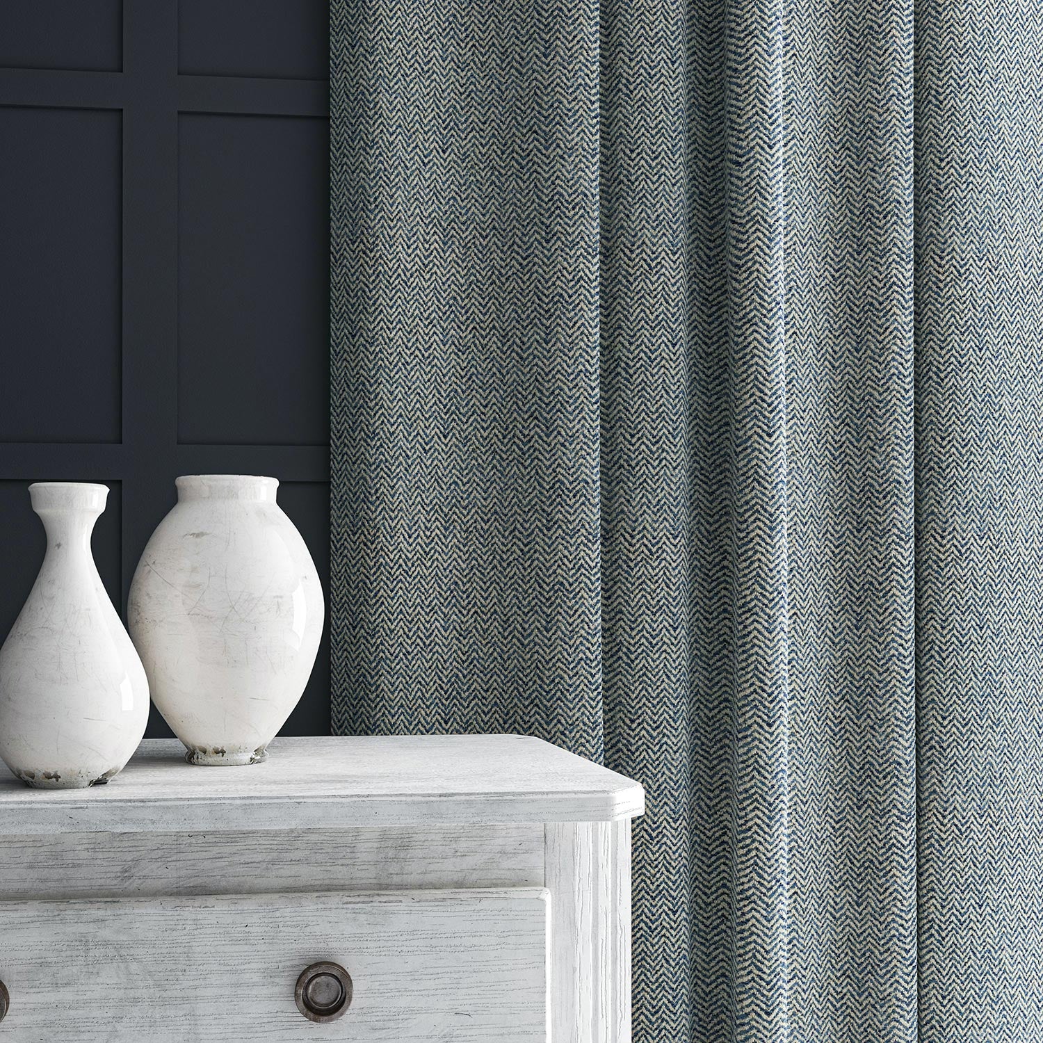 Curtain in blue and off-white woven fabric featuring a herringbone pattern.