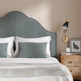 Headboard upholstered in a blue and off-white woven fabric featuring a herringbone pattern.