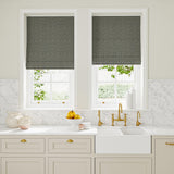 Blinds in blue and off-white woven fabric featuring a herringbone pattern.